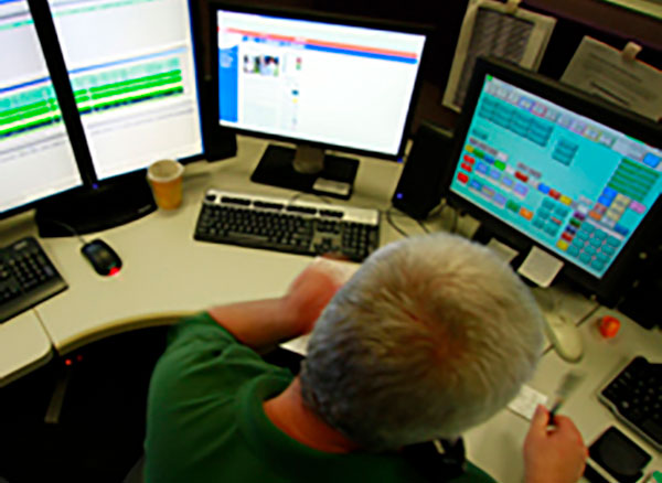 Man at desk with computer software